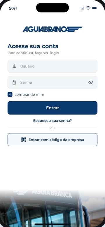Tela de login do app Águia Branca: marca no topo, campos de usuário e senha, botão Entrar e opção de entrar com o código da empresa, com um ônibus da Águia Branca ao fundo